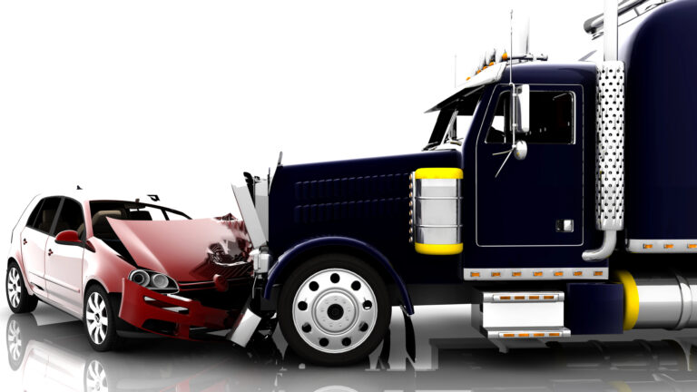 A large semi-truck collides head-on with a red car, causing significant damage to the cars front end.