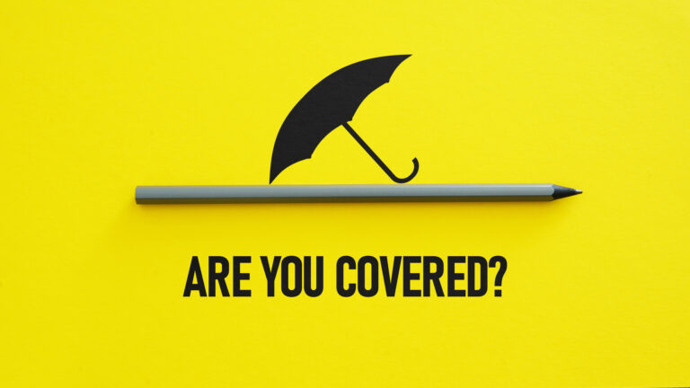 A black umbrella graphic above a gray pencil on a yellow background with the text ARE YOU COVERED? written below.